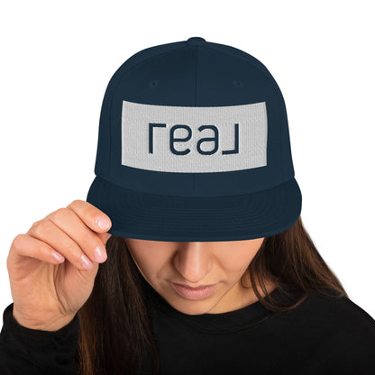 Snapback Hat - Embroidered "Real" logo